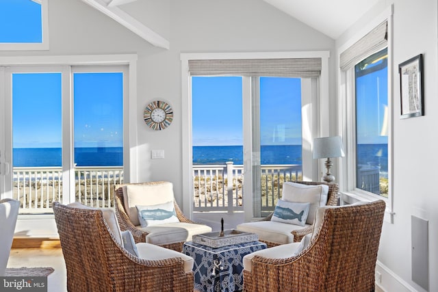 6601 Ocean Blvd, Long Beach Township, NJ 08008 - sitting room featuring vaulted ceiling, a water view, and wood finished floors