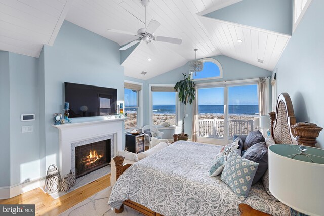 6601 Ocean Blvd, Long Beach Township, NJ 08008 - bedroom with vaulted ceiling, wood finished floors, a premium fireplace, ceiling fan, and wooden ceiling