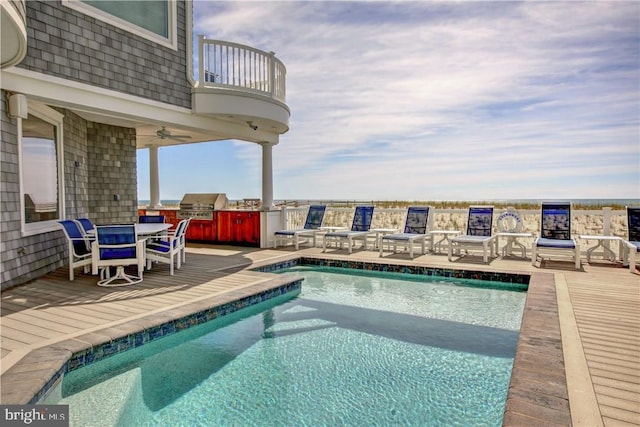 6601 Ocean Blvd, Long Beach Township, NJ 08008 - swimming pool with an outdoor kitchen, outdoor dining area, area for grilling, a patio area, and ceiling fan