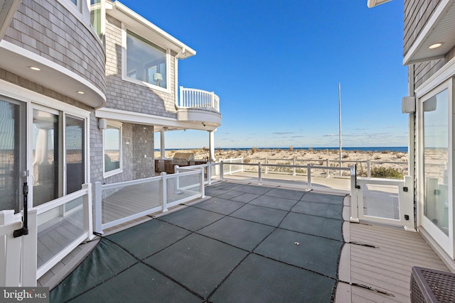 6601 Ocean Blvd, Long Beach Township, NJ 08008 - view of patio with a balcony and a water view