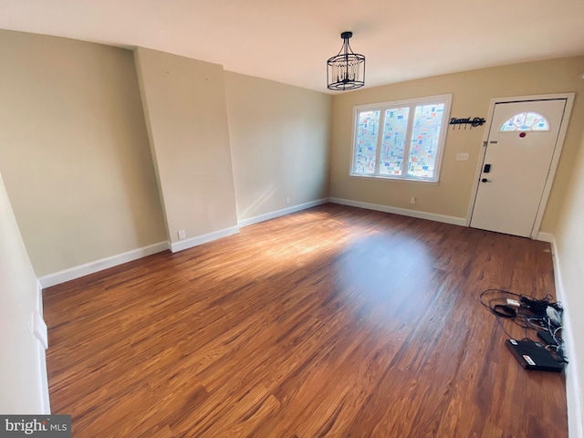 976 Klockner Rd, Hamilton Township, NJ 08619 - unfurnished dining area featuring wood finished floors, baseboards, and a chandelier