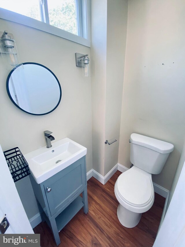 976 Klockner Rd, Hamilton Township, NJ 08619 - half bath featuring wood finished floors, vanity, toilet, and baseboards