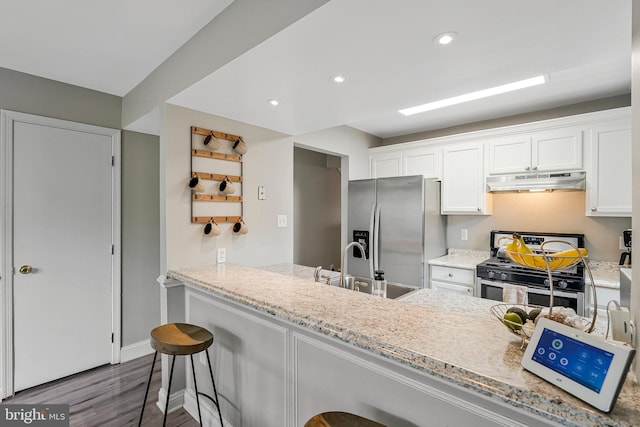 3424 Lockheed Blvd Unit F, Alexandria, VA 22306 - kitchen with appliances with stainless steel finishes, under cabinet range hood, a sink, dark wood-style flooring, and white cabinets