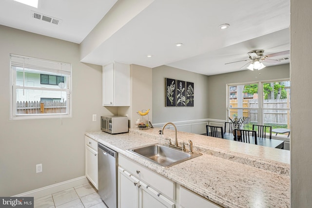 3424 Lockheed Blvd Unit F, Alexandria, VA 22306 - kitchen featuring appliances with stainless steel finishes, a sink, white cabinets, a ceiling fan, and baseboards