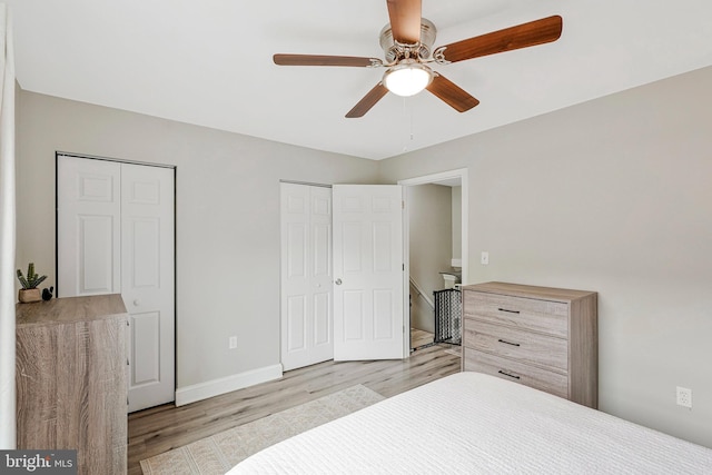 3424 Lockheed Blvd Unit F, Alexandria, VA 22306 - bedroom featuring light wood finished floors, two closets, baseboards, and ceiling fan
