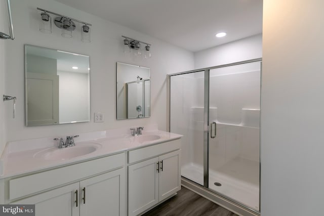 93 6th St W, Laurel, DE 19956 - full bath with a stall shower, wood finished floors, double vanity, and recessed lighting