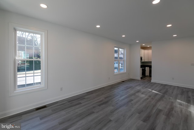 93 6th St W, Laurel, DE 19956 - unfurnished living room with recessed lighting, dark wood-style flooring, and baseboards