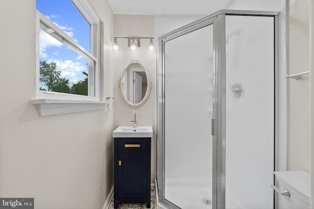 full bathroom with a shower stall and vanity