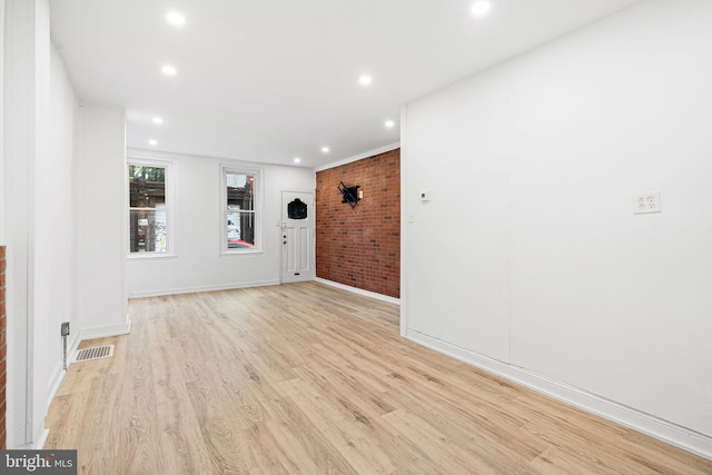 2943 Gransback St, Philadelphia, PA 19134 - empty room featuring brick wall, light wood-style flooring, recessed lighting, and baseboards