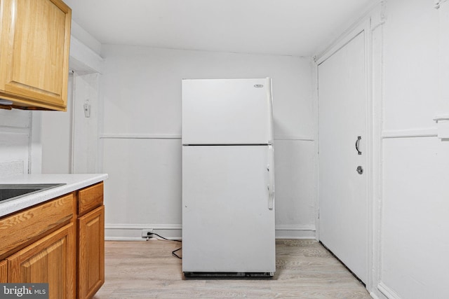2943 Gransback St, Philadelphia, PA 19134 - kitchen featuring freestanding refrigerator, light wood-style flooring, and light countertops