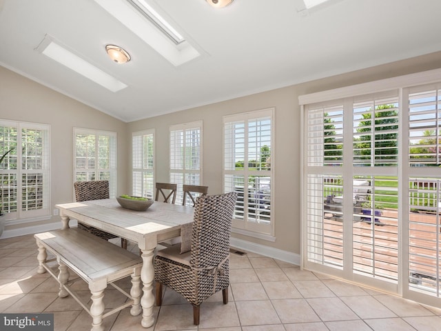 606 Borough Line Rd, Collegeville, PA 19426 - dining space featuring lofted ceiling, healthy amount of natural light, light tile patterned flooring, and baseboards