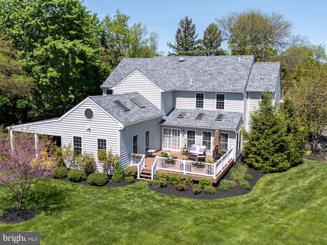 606 Borough Line Rd, Collegeville, PA 19426 - rear view of property with a deck and a lawn