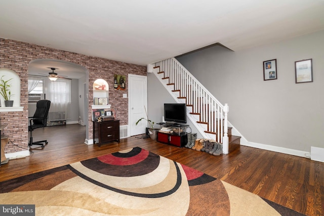4504 Vista St, Philadelphia, PA 19136 - living area featuring wood finished floors, stairway, brick wall, a ceiling fan, and baseboards