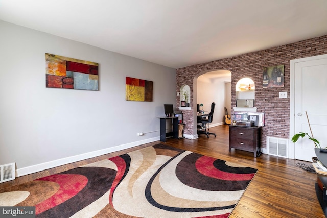 4504 Vista St, Philadelphia, PA 19136 - office area with arched walkways, brick wall, wood finished floors, and baseboards
