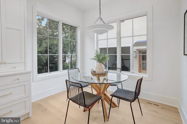 1416 N Hancock St, Arlington, VA 22201 - dining area featuring light wood-style floors, healthy amount of natural light, and baseboards