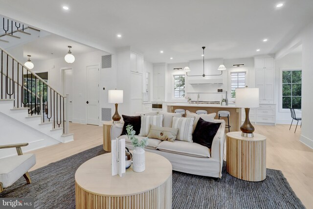1416 N Hancock St, Arlington, VA 22201 - living area featuring light wood-type flooring, stairway, recessed lighting, and baseboards