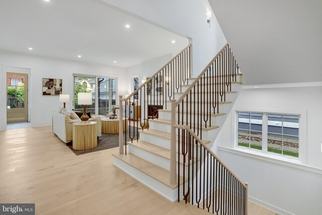 1416 N Hancock St, Arlington, VA 22201 - staircase with wood finished floors, recessed lighting, and baseboards