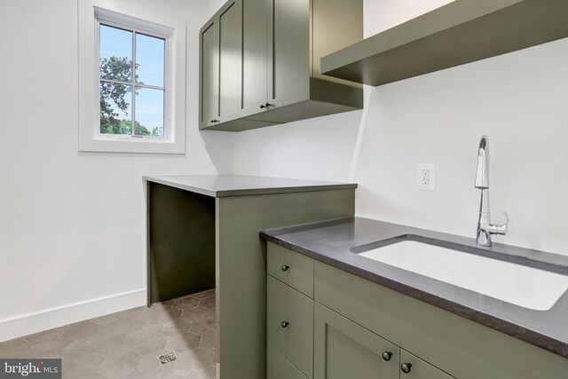 1416 N Hancock St, Arlington, VA 22201 - laundry room with a sink and baseboards