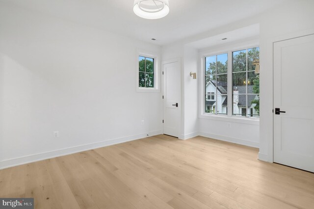 1416 N Hancock St, Arlington, VA 22201 - spare room featuring light wood finished floors, baseboards, and healthy amount of natural light