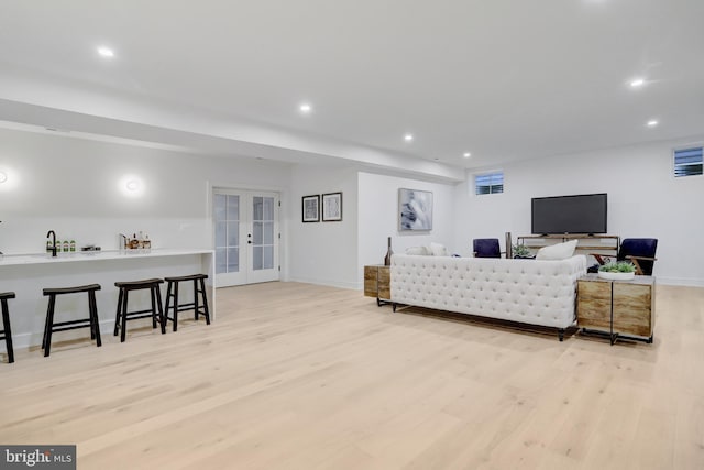 1416 N Hancock St, Arlington, VA 22201 - living room featuring light wood-type flooring, recessed lighting, french doors, and baseboards