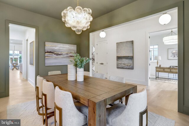 1416 N Hancock St, Arlington, VA 22201 - dining space with a chandelier, plenty of natural light, light wood-type flooring, and baseboards