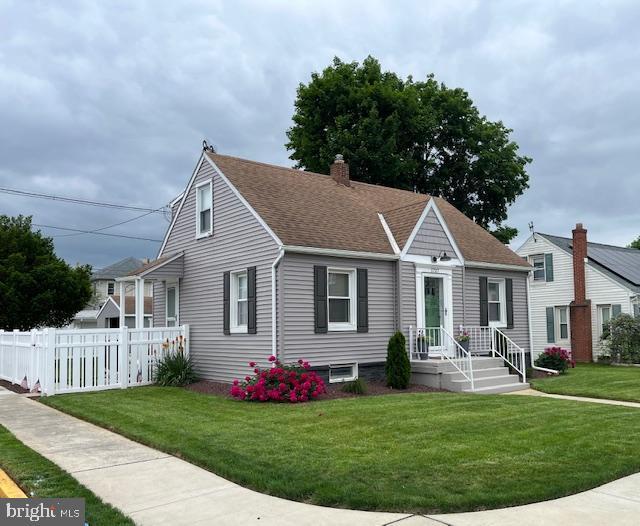 view of front of property with a chimney and a shingled roof
