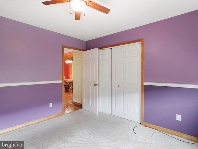 18421 Lower Georges Creek Rd SW, Barton, MD 21521 - unfurnished bedroom featuring carpet flooring, a closet, a ceiling fan, baseboards, and a chandelier