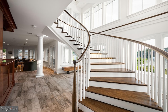 17 Revell St, Annapolis, MD 21401 - stairway with decorative columns, wood finished floors, and plenty of natural light