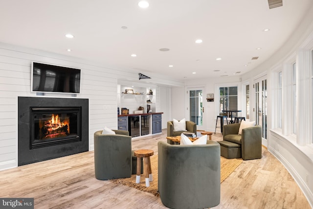17 Revell St, Annapolis, MD 21401 - living room with wood finished floors, a glass covered fireplace, recessed lighting, and beverage cooler