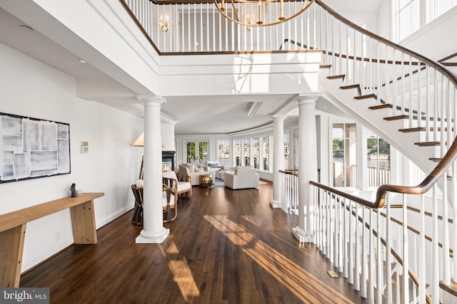 17 Revell St, Annapolis, MD 21401 - stairs featuring ornate columns, a high ceiling, and wood finished floors