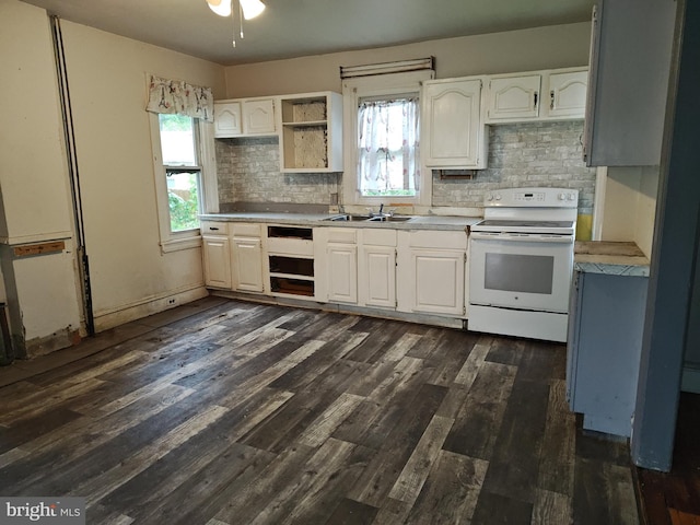 kitchen featuring white range with electric stovetop, tasteful backsplash, dark wood-type flooring, and a sink