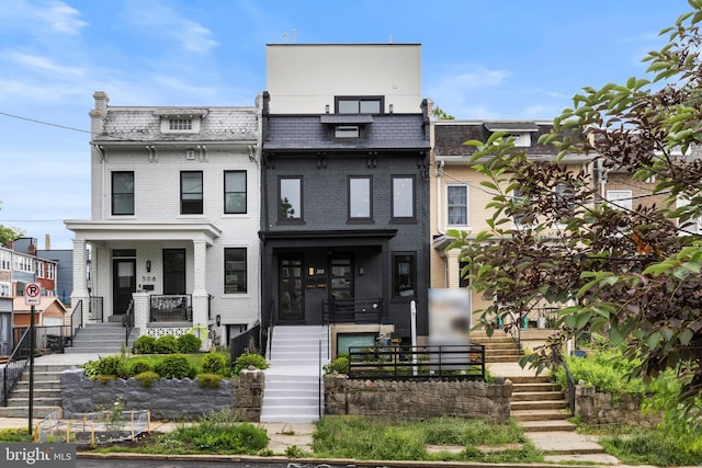 310 Varnum St NW Unit 3Ph, Washington, DC 20011 - view of front of property featuring stairs, mansard roof, and brick siding