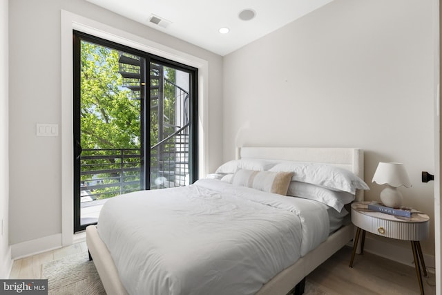 310 Varnum St NW Unit 3Ph, Washington, DC 20011 - bedroom with baseboards, wood finished floors, access to exterior, and recessed lighting