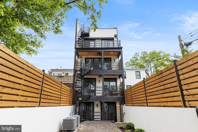 310 Varnum St NW Unit 3Ph, Washington, DC 20011 - contemporary house featuring a balcony, stairs, and a fenced backyard