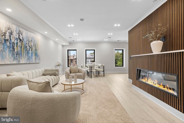 310 Varnum St NW Unit 3Ph, Washington, DC 20011 - living area featuring wood finished floors, recessed lighting, baseboards, a glass covered fireplace, and ornamental molding