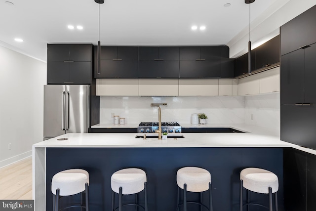 310 Varnum St NW Unit 3Ph, Washington, DC 20011 - kitchen with high end fridge, modern cabinets, a sink, a breakfast bar, and light countertops