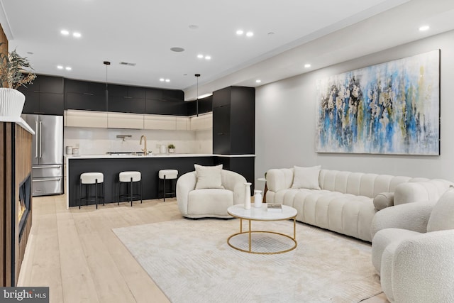 310 Varnum St NW Unit 3Ph, Washington, DC 20011 - living area with light wood-style floors and recessed lighting