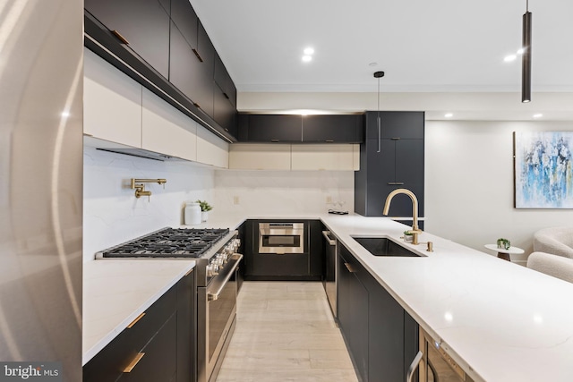 310 Varnum St NW Unit 3Ph, Washington, DC 20011 - kitchen with stainless steel appliances, a sink, dark cabinetry, modern cabinets, and recessed lighting