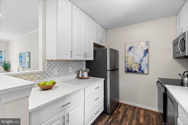 1716 W Abingdon Dr Unit 103, Alexandria, VA 22314 - kitchen with appliances with stainless steel finishes, backsplash, white cabinetry, and crown molding