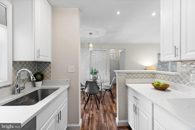 1716 W Abingdon Dr Unit 103, Alexandria, VA 22314 - kitchen with a sink, dark wood-type flooring, white cabinets, tasteful backsplash, and recessed lighting