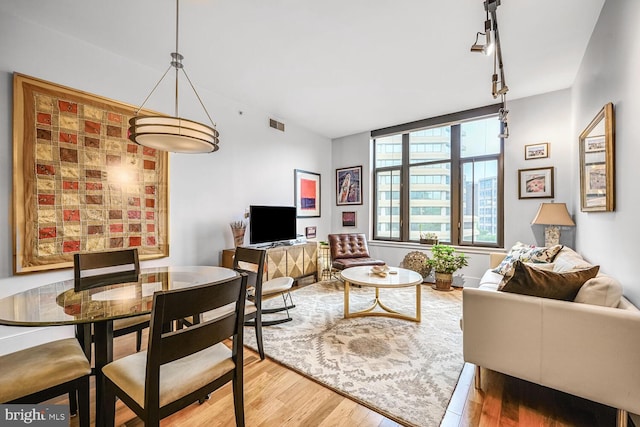 4301 Military Rd NW Unit 504, Washington, DC 20015 - living room featuring wood finished floors