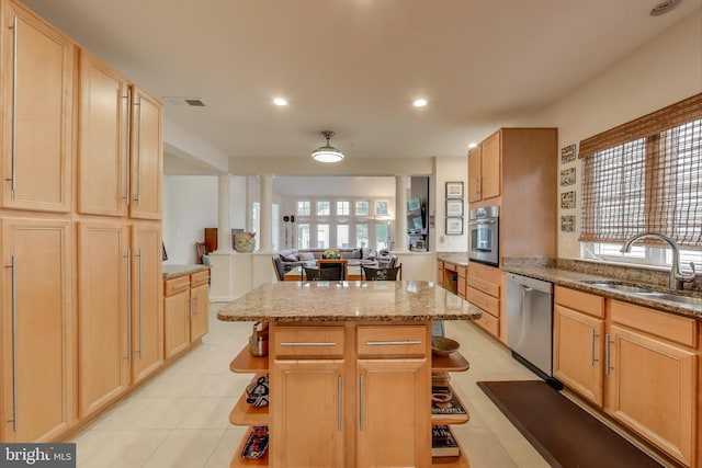 13605 Autumn End Ter, Laurel, MD 20707 - kitchen featuring stainless steel appliances, decorative columns, a sink, a center island, and light stone countertops