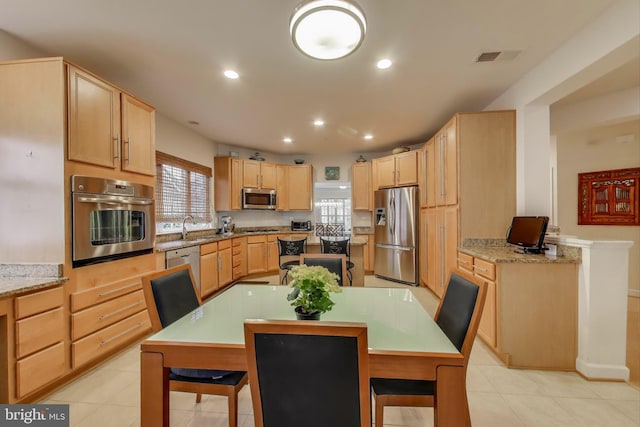 13605 Autumn End Ter, Laurel, MD 20707 - kitchen featuring stainless steel appliances, light brown cabinetry, recessed lighting, light tile patterned floors, and a sink