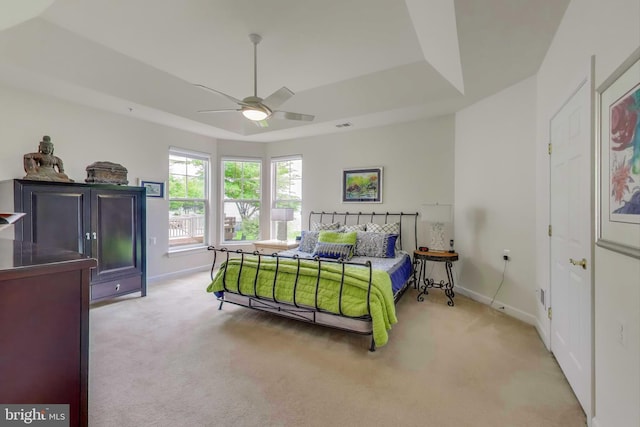 13605 Autumn End Ter, Laurel, MD 20707 - bedroom with carpet floors, baseboards, a tray ceiling, and a ceiling fan