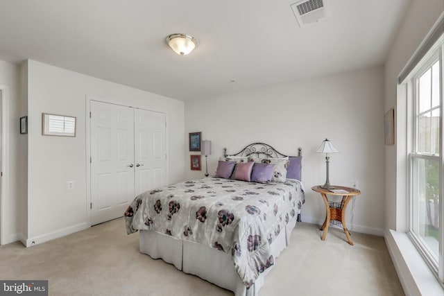 13605 Autumn End Ter, Laurel, MD 20707 - bedroom with light carpet, baseboards, and a closet
