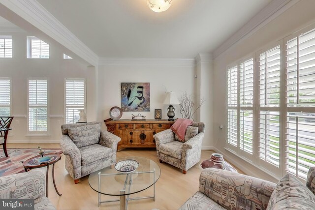 13605 Autumn End Ter, Laurel, MD 20707 - living area featuring healthy amount of natural light, crown molding, wood finished floors, and baseboards