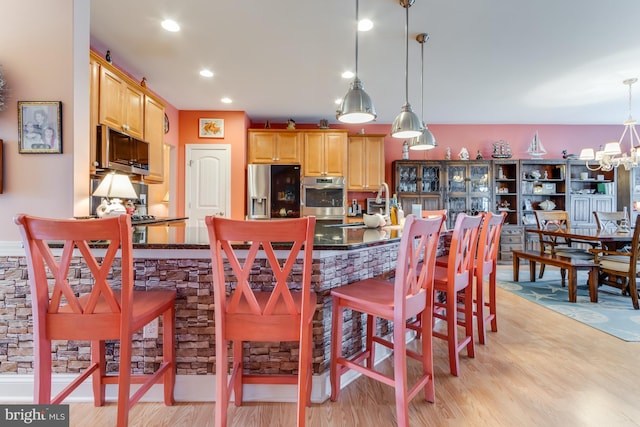 15149 Coultlands Reach, Milton, DE 19968 - dining space featuring light wood-type flooring, a chandelier, and recessed lighting