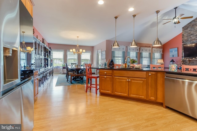15149 Coultlands Reach, Milton, DE 19968 - kitchen featuring stainless steel appliances, a chandelier, a sink, light wood finished floors, and a ceiling fan