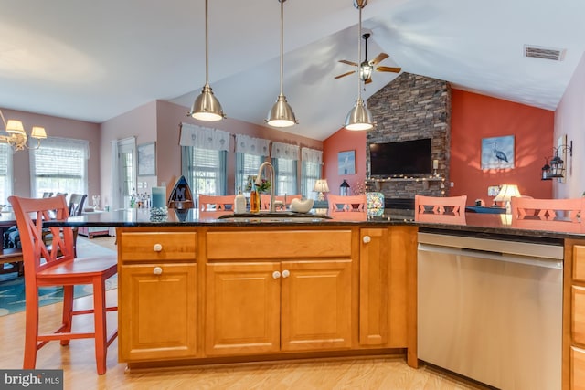 15149 Coultlands Reach, Milton, DE 19968 - kitchen with stainless steel dishwasher, a sink, ceiling fan, dark stone counters, and open floor plan