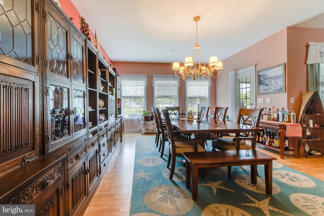 15149 Coultlands Reach, Milton, DE 19968 - dining area featuring a chandelier, light wood finished floors, and plenty of natural light